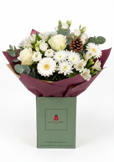 A classic Christmas bouquet of flowers in crisp whites and fresh seasonal greens &pound;50
